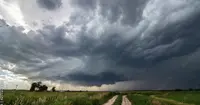 Storm front approaching over farmland