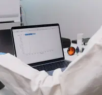 Engineer reviewing a sensor readout on a laptop