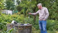 Lowering the AquaSensIO probe into a garden well