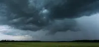 Storm shelf cloud over a field